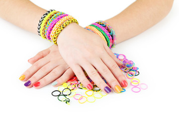 Obraz na płótnie Canvas Loom bracelets on hands of young girl