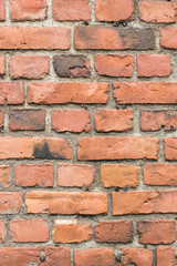 Obraz premium Old deteriorated red brick wall texture background
