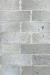 Fototapeta premium Close-up of a grey concrete block wall texture background