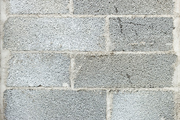 Close-up of a grey concrete block wall texture background
