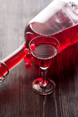 Red wine with red currant berries