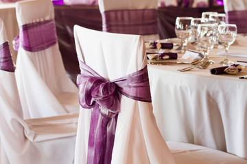 Fototapeta na wymiar wedding chairs with ribbon