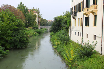 Fototapeta na wymiar River and bridge in Padua, Italy