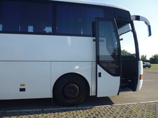 white internationl bus with open doors