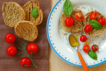 Apulian bread friselle with tomatoes, basil, olive oil, origan