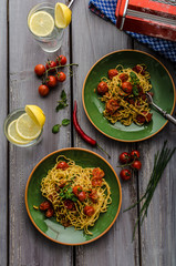 Homemade semolina spaghetti with cherry