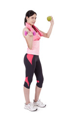 Girl with dumbbells and apple
