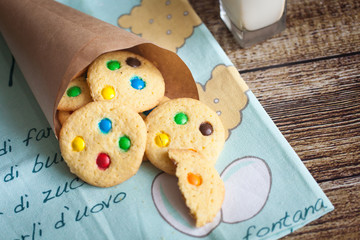 Homemade cookies with color candies in cornet