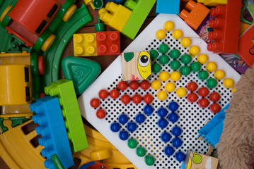 plastic toys on a wooden base