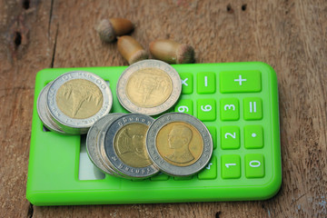 Thailand bath coins on a wooden vintage