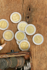 Thailand bath coins on a wooden vintage