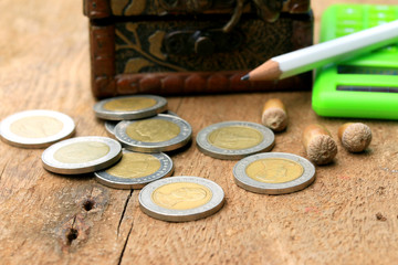 Thailand bath coins on a wooden vintage