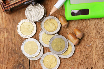 Thailand bath coins on a wooden vintage