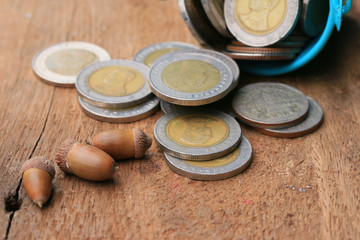 Thailand bath coins on a wooden vintage