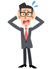 メガネをかけたビジネスマンが頭を抱える