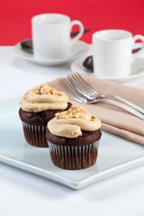 Muffin breakfast with espresso coffee in shallow depth of field