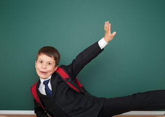 school boy portrait near board