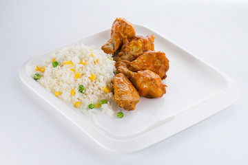 Curry chicken with rice on a white plate