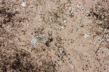 Textured walls with dirt.
