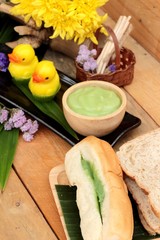Bread with green custard and fresh milk.
