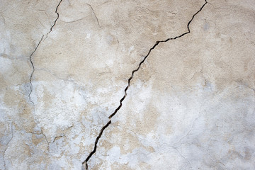 Grunge concrete cement wall with crack in industrial building, great for design and texture background