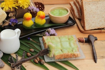 Bread with green custard and fresh milk.