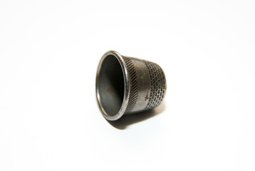 Iron thimble for hand embroidery on a white background