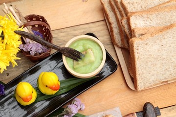 Bread with green custard and fresh milk.