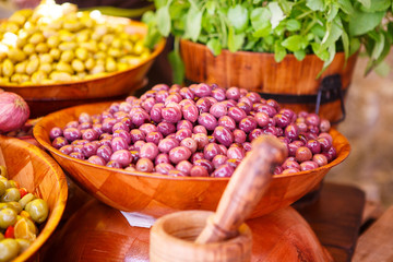 Marinated garlic and olives on provencal street market in Proven