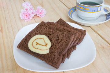sliced chocolate bread with jam roll cakes
