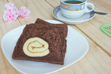sliced chocolate bread with jam roll cakes