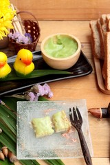 Bread with green custard and fresh milk.