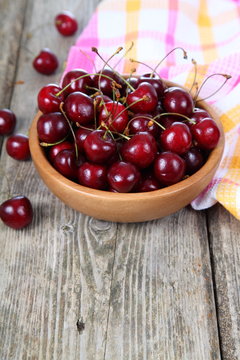 Ripe cherry in a wooden bowl