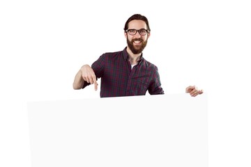 Handsome hipster showing large poster