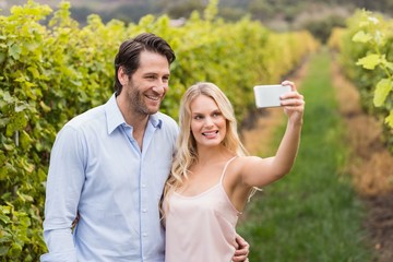 Young happy couple taking a selfie