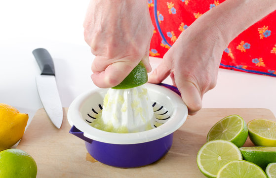 Woman Squeezing Half A Lime