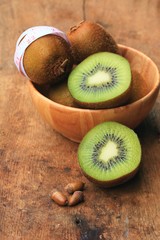 fresh kiwi fruit and tape measure