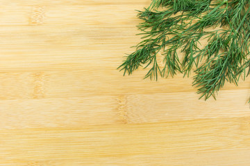 Green dill on wood backgrounds