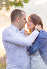 Obraz premium Happy young couple in love. Hugging at the park. 
