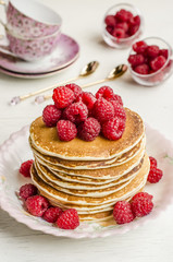 Pancake with sauce and raspberries  