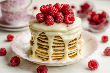 Pancake with sauce and raspberries  