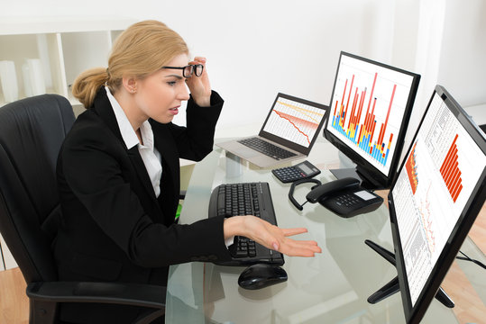 Businesswoman Looking At Graph On Computer