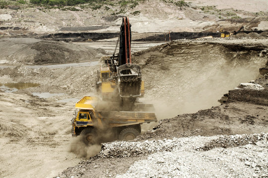 excavator at work in an open-pit mine