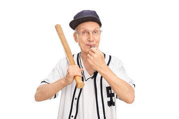 Senior holding baseball bat and blowing a whistle