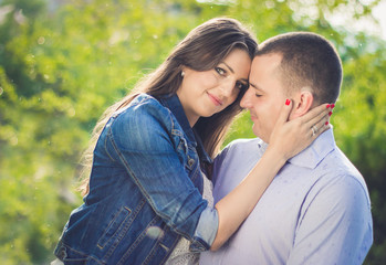 Happy Smiling Couple in love. Hugging at park.