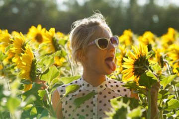 Woman clowns in the sunflowers