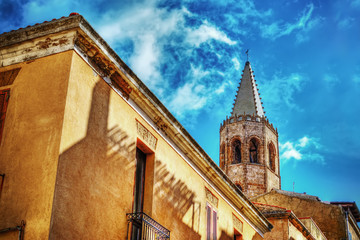 Duomo steeple under clouds in Alghero