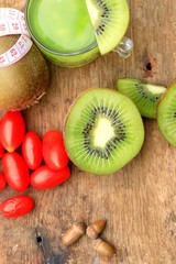 fresh kiwi juice and strawberry on wood vintage