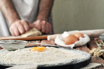 handful of flour with egg yolk