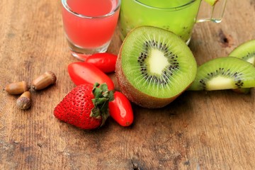 fresh kiwi juice and strawberry on wood vintage